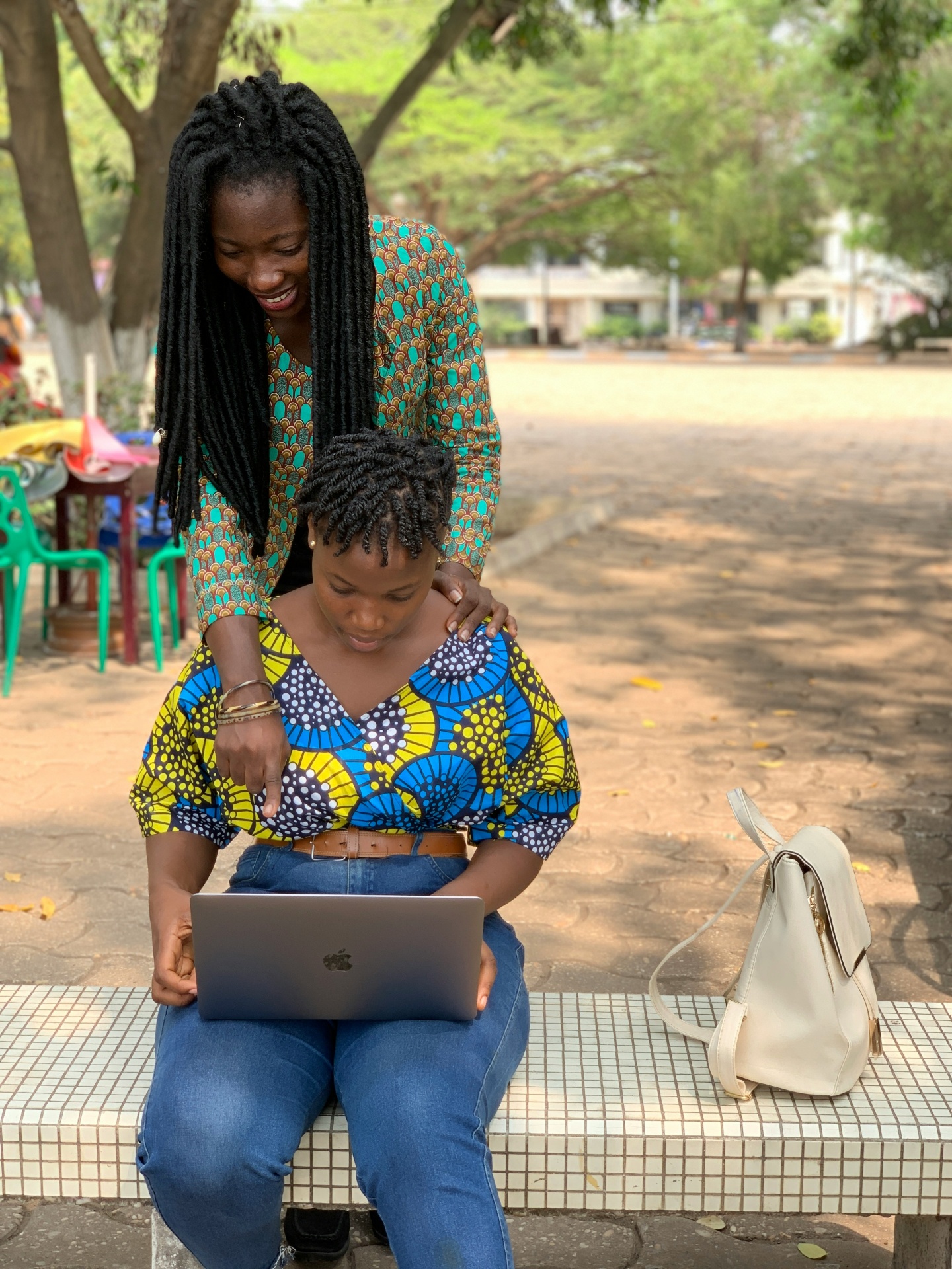 A parent and student reviewing colleges together